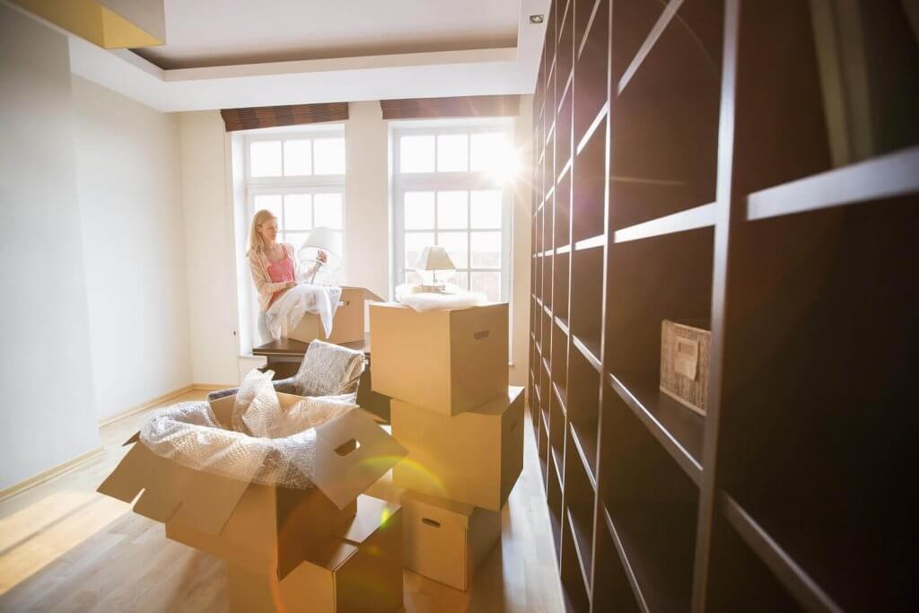 A girl arranging the house after moving in Hurst, TX